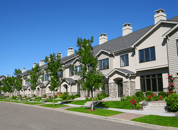 Several attached condo units on a street